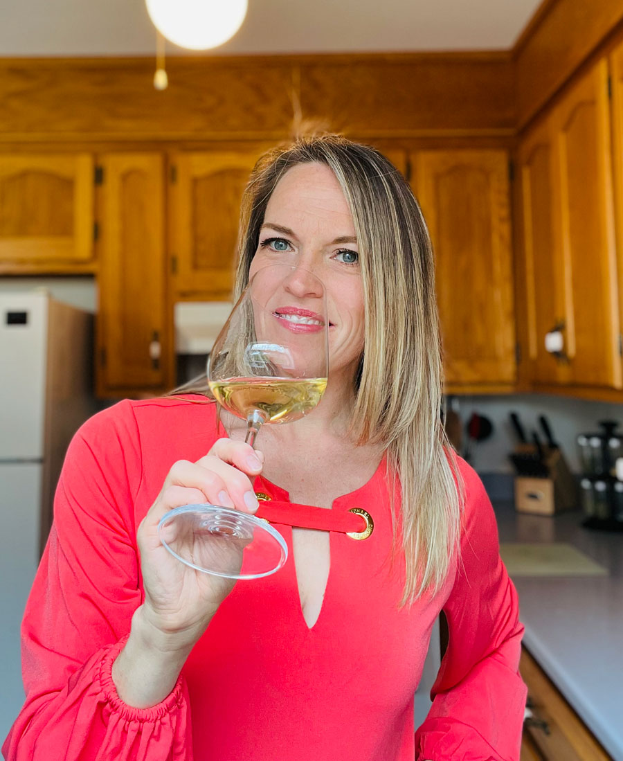 Kristin Perrin drinking a glass of wine